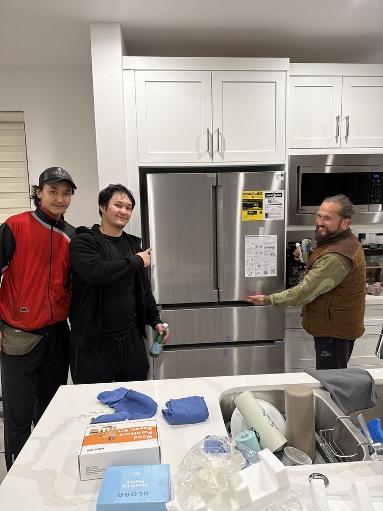 Professional movers loading truck with care