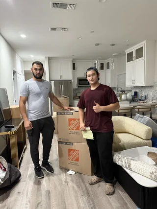 Team member with moving supplies